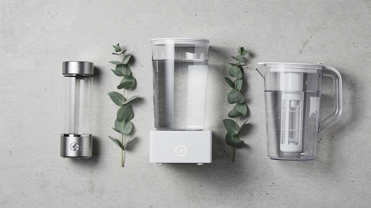 Five hydrogen water generators arranged on a quartz countertop with H2 Blue reagent test kit demonstrating independent verification methodology