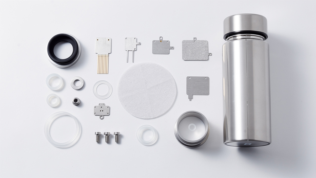 Hydrogen water bottle PEM electrolysis components laid out for inspection